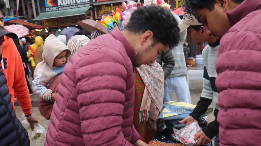 Srinagar youth distribute clothes to needy ahead of Eid