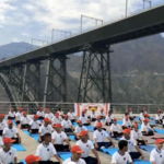 NCC Cadets perform yoga at Chenab Rail Bridge on International Yoga Day in Reasi
