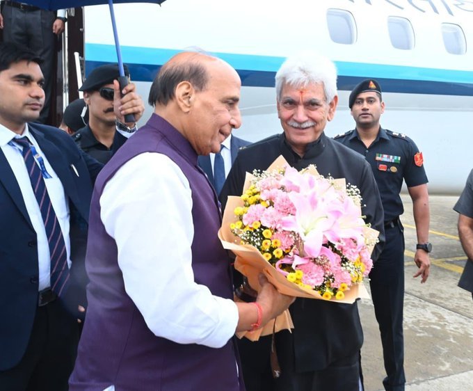 J&K LG Manoj Sinha receives Defence Minister Rajnath Singh at Srinagar airport