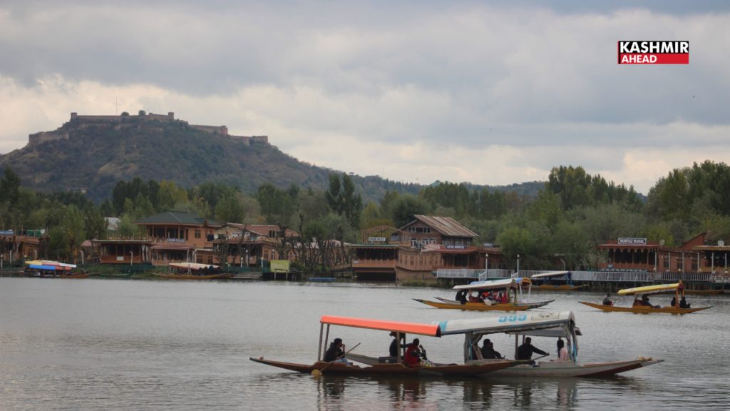 Tourists enjoy Shikara ride on Dal Lake amid pleasant weather